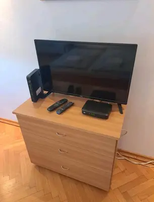 a flat screen tv sitting on top of a dresser at Apartman 2001 Stari grad in Belgrade