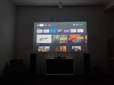 a projection screen in a room with a table at Apartment Norman Bates in Belgrade