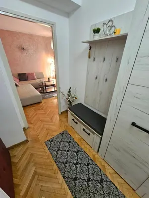a room with a door leading to a living room at Slavija Apartment in Belgrade