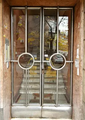 an entrance to a building with two metal doors at Studio Sky in Belgrade