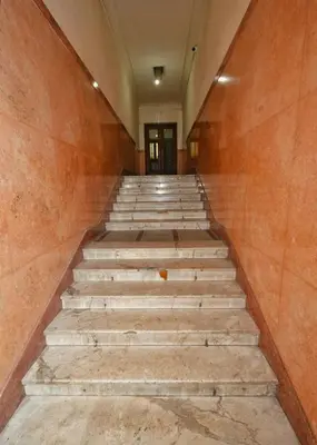 an empty hallway with stairs in a building at Studio Sky in Belgrade