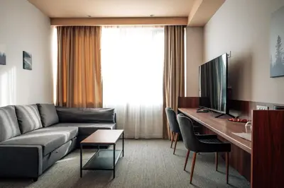 a living room with a couch and a desk at CIRCLE OF 2 in Belgrade
