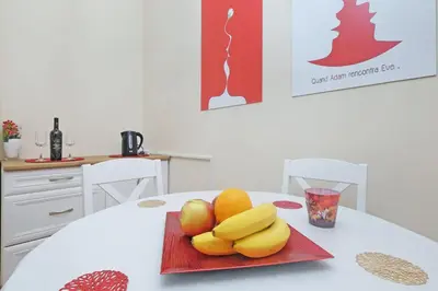 a plate of fruit sitting on top of a table at Illusion Downtown Apartment in Belgrade