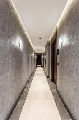 a hallway in a building with a long corridor at The Residence 59 in Belgrade