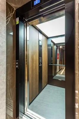 an elevator door with a mirror in a building at The Residence 59 in Belgrade