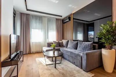 a living room with a couch and a table at The Residence 59 in Belgrade