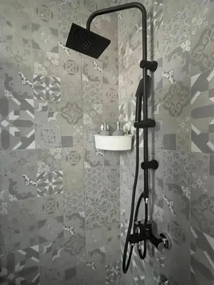 a bathroom with a shower with a sink at Old soul of Skadarlija in Belgrade