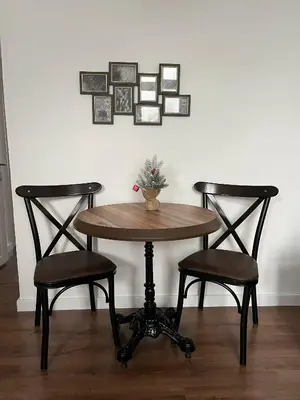 a table with two chairs and a table with a plant on it at Old soul of Skadarlija in Belgrade
