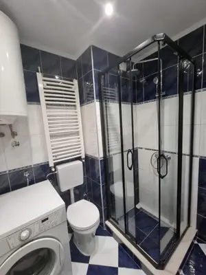 a bathroom with a toilet and a glass shower at Malina in Belgrade