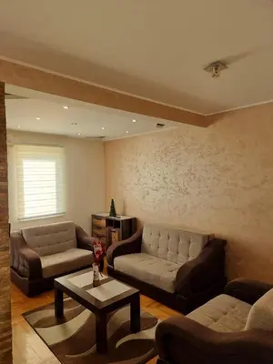 a living room with couches and a coffee table at Malina in Belgrade