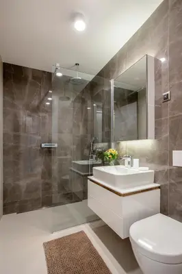 a bathroom with a sink and a toilet and a mirror at Leo Urban Lux, comfort - Central Stay, Free Garage in Belgrade
