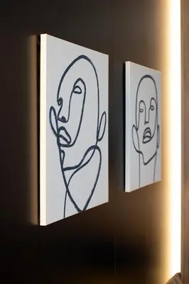 two drawings of people hanging on a wall at Leo Urban Lux, comfort - Central Stay, Free Garage in Belgrade