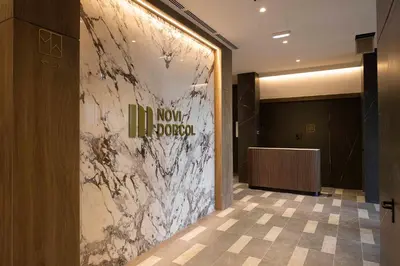 a lobby with a marble wall in a building at Leo Urban Lux, comfort - Central Stay, Free Garage in Belgrade