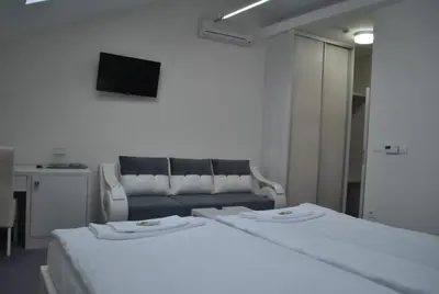 a living room with two beds and a couch at Villa Marija M L in Belgrade