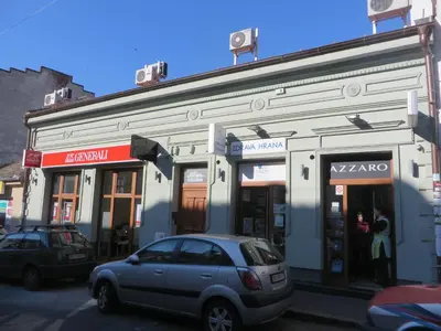 a gray car parked in front of a building at Villa Marija M L in Belgrade