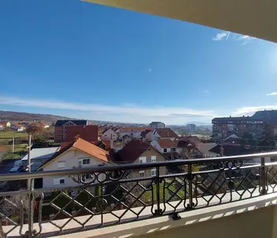 a balcony with a view of a city at Lider Lux Apartman in Arandjelovac