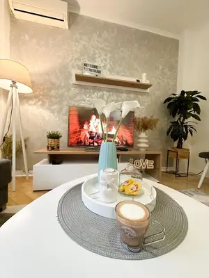 a table with a tray of food and a fireplace at Train 23 in Belgrade