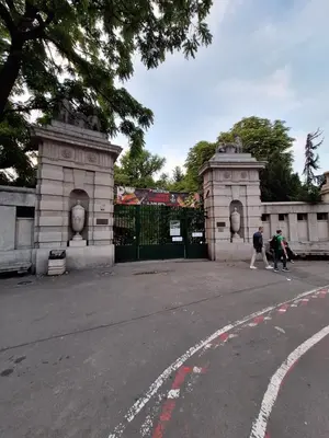 two people walking in front of a gate at Palma studio in Belgrade
