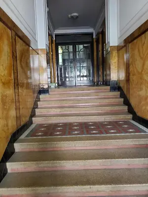 an empty hallway with stairs leading to a door at Palma studio in Belgrade