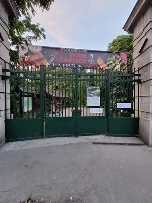 a green gate in front of a building at Palma studio in Belgrade