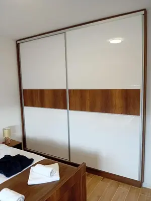 a bedroom with a large glass wall at Ruma Deluxe 90m2 in Ruma