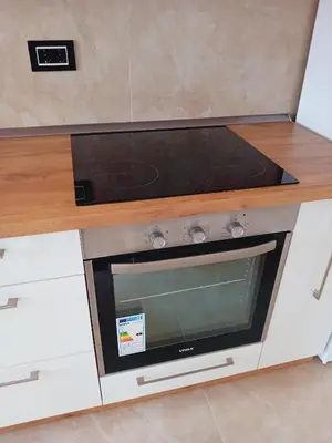 a kitchen counter with a stove top oven at Ruma Deluxe 90m2 in Ruma