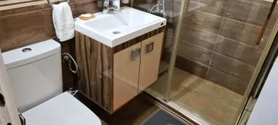a bathroom with a sink and a toilet at Grey apartment Novi Beograd in Belgrade