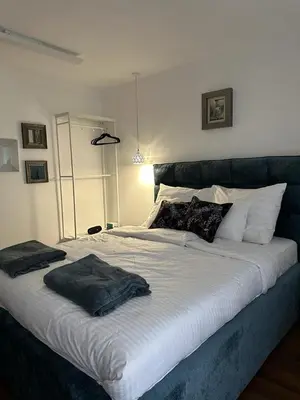 a large bed with two pillows on top of it at NBG113 apartment in Belgrade