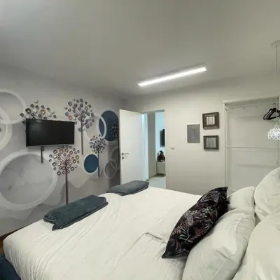 a bedroom with a bed with two pillows on it at NBG113 apartment in Belgrade