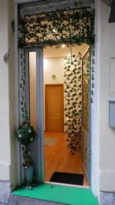 a door leading into a room with a hallway at Cozy place in Belgrade