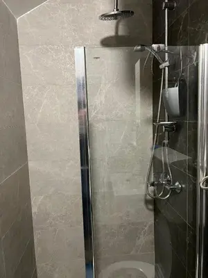 a shower with a glass door in a bathroom at Old town Belgrade apartment in Belgrade