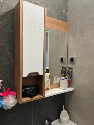 a mirror above a sink in a bathroom at Old town Belgrade apartment in Belgrade