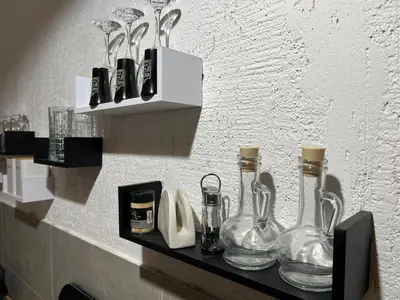 a shelf with glass vases on a wall at Old town Belgrade apartment in Belgrade