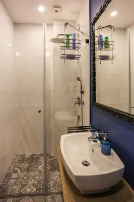 a bathroom with a sink and a shower at Moment Boutique Apartments in Belgrade