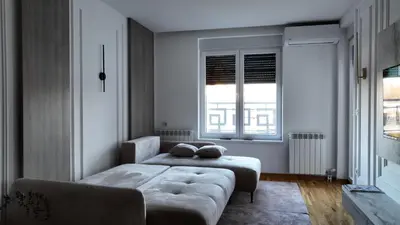 a bedroom with a couch and two windows at New&Luxurious, Central&Comfortable in Belgrade