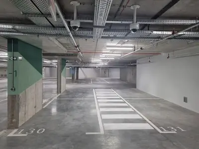 an empty parking lot in an empty parking garage at Galerija Libera in Belgrade