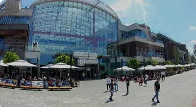 a group of people walking in front of a building at Galerija Libera in Belgrade
