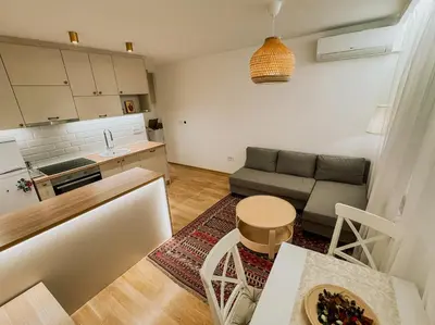 a small living room with a couch and a table at Sweet House Skadar Lux in Belgrade