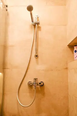 a shower head on a wall in a bathroom at Sweet House Skadar Lux in Belgrade