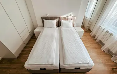 a row of beds in a room at Sweet House Skadar Lux in Belgrade