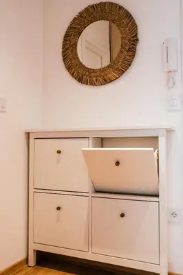 a dresser in a room with a mirror at Sweet House Skadar Lux in Belgrade