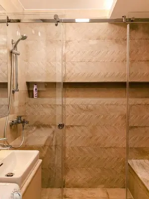 a shower with a glass door in a bathroom at Sweet House Skadar Lux in Belgrade