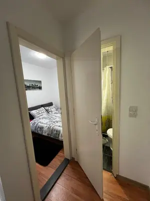 an open door to a bedroom with a bed at Apartment Dida Ledine in Belgrade