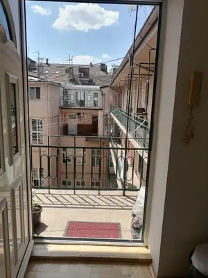 a view of a balcony from a window at Small low cost studio in Belgrade