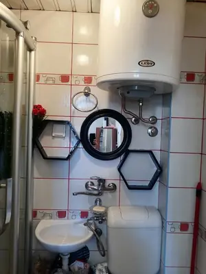 a small bathroom with a toilet and a sink at Small low cost studio in Belgrade