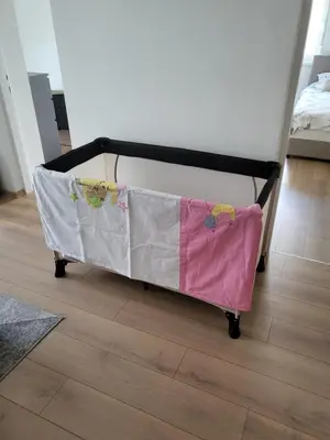 a bed cart with a blanket on it in a room at Slavija Lux! 2 Bedroom Apartment city center in Belgrade