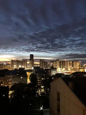 a view of a city skyline at night at Lenny apartman in Belgrade