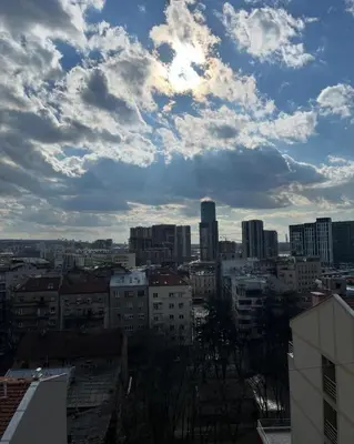 a view of a city under a cloudy sky at Lenny apartman in Belgrade