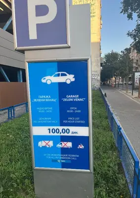 a sign for a car dealership on the side of a street at Lenny apartman in Belgrade