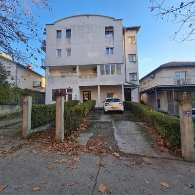 a white car parked in front of a building at APARTMAN011 in Mirijevo